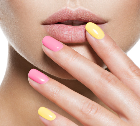 fashion woman with beautiful multicolored nails